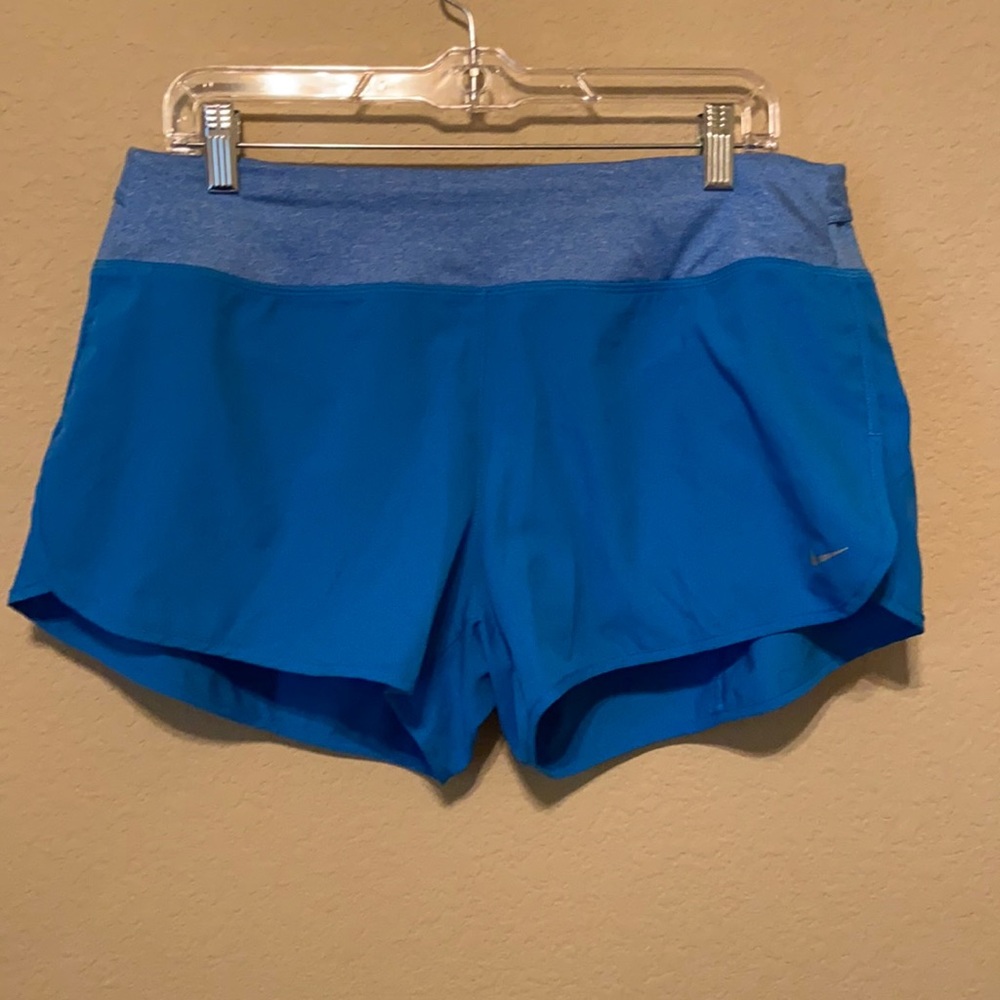 Nike women’s DRI-FIT running shorts. Size L